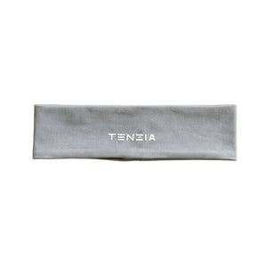 Gray headband with 'TENZIA' branding on a beige background